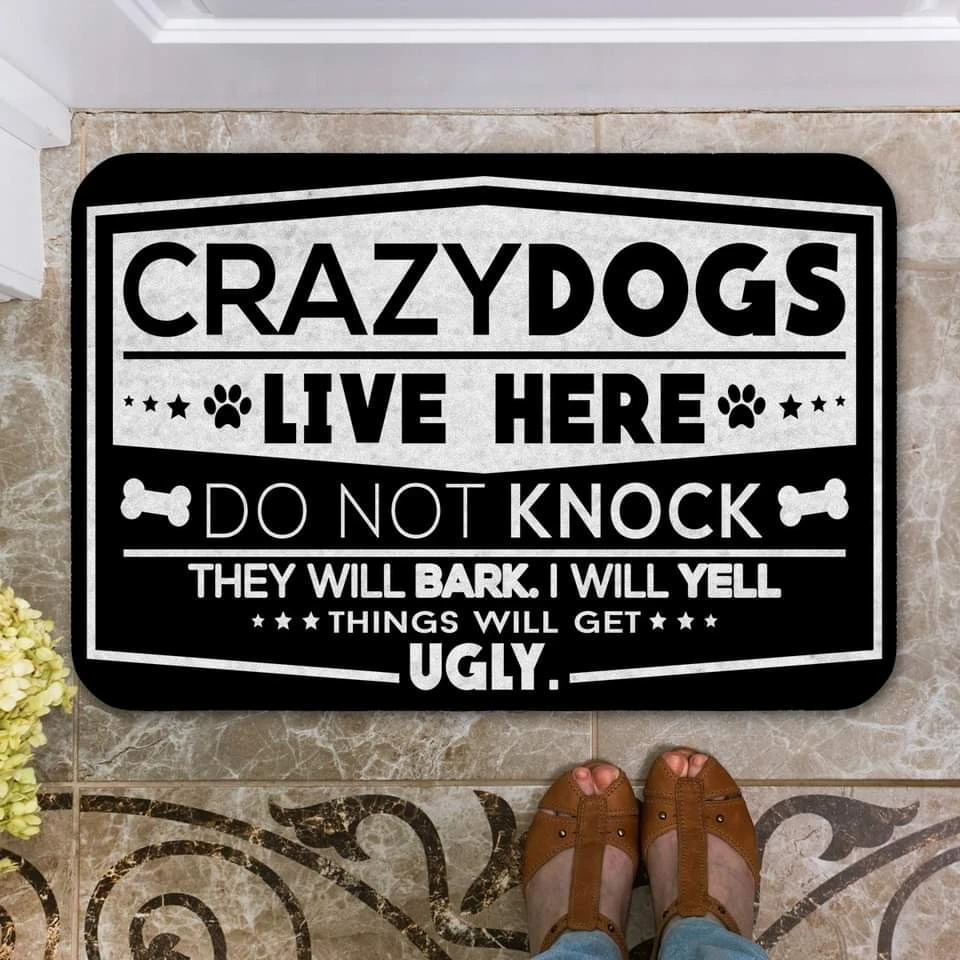 Crazy dogs live here do not knock doormat